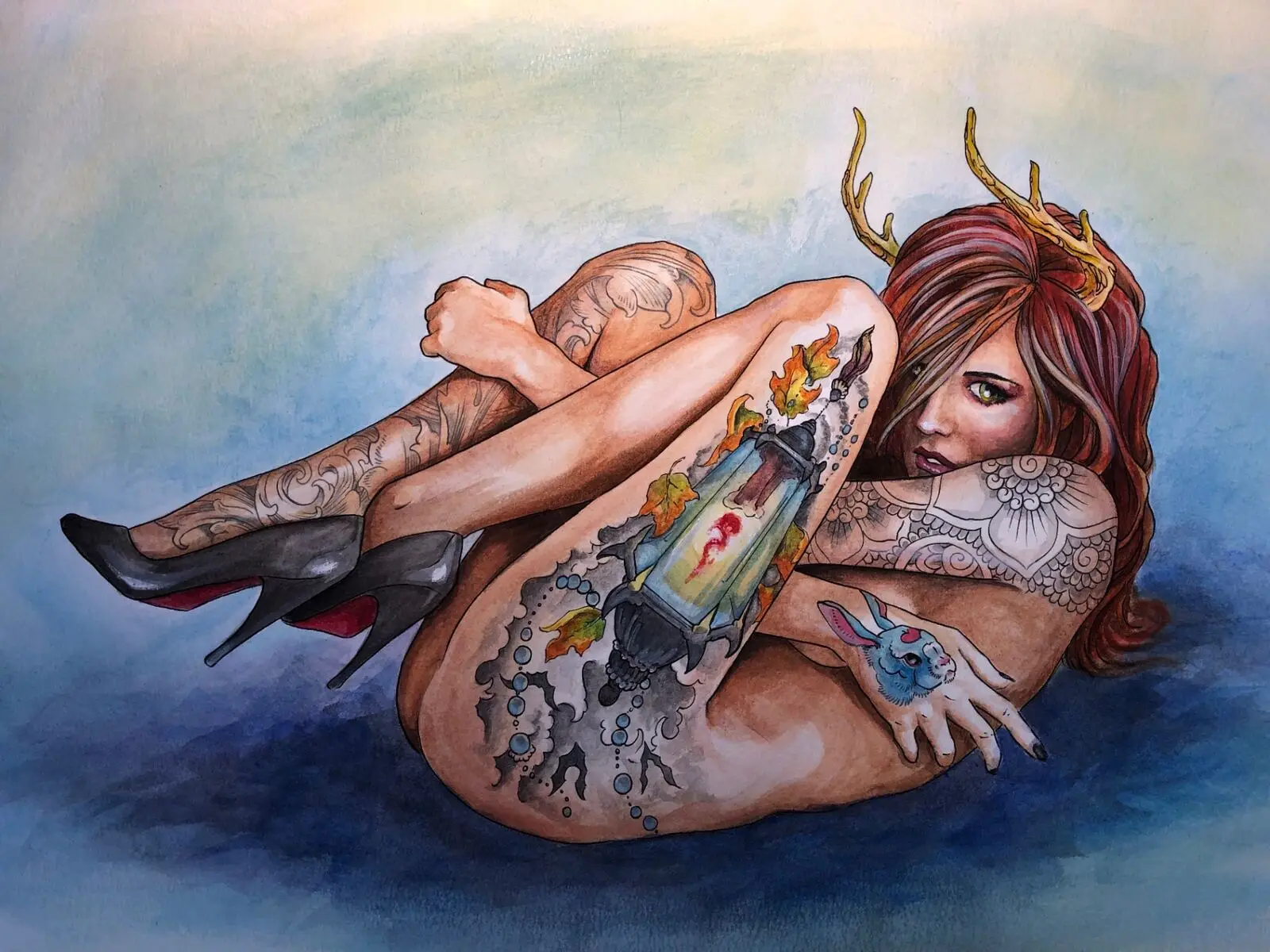Finished watercolor of the antlered redhead pinup with full body tattoos curled around a glowing lantern over a moody blue wash