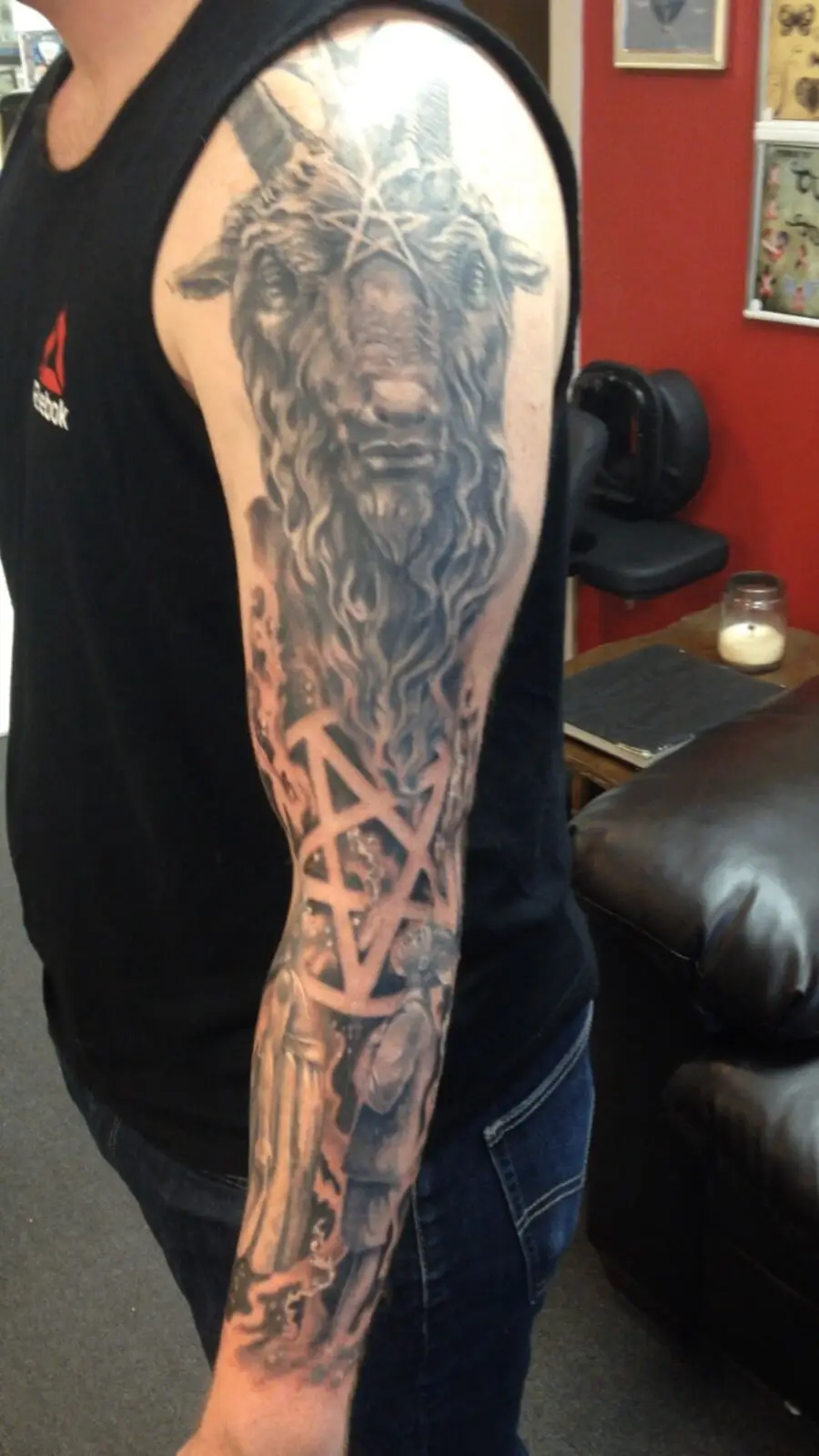 Black and grey sleeve featuring a horned occult portrait and geometric symbol work