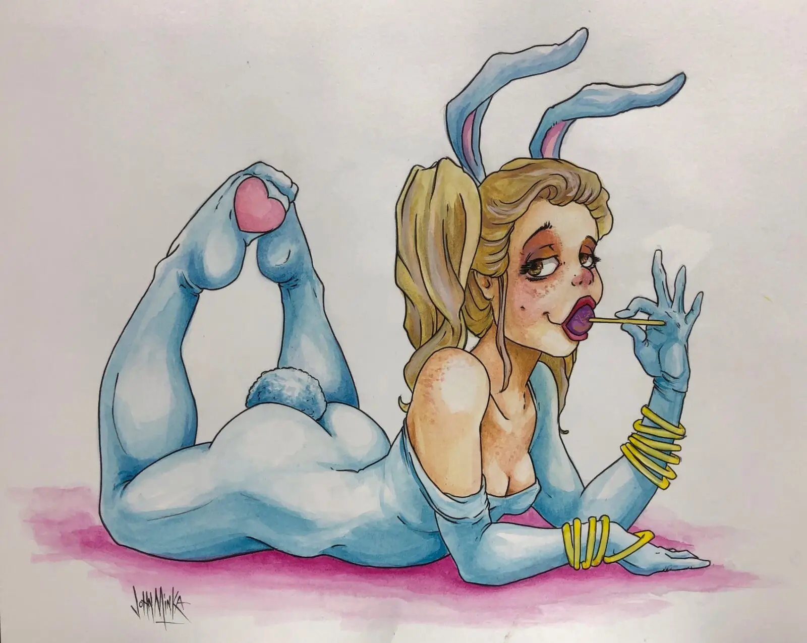 Watercolor pinup of a blonde pigtailed girl in a blue bunny costume with rabbit ears licking a lollipop on a pink ground