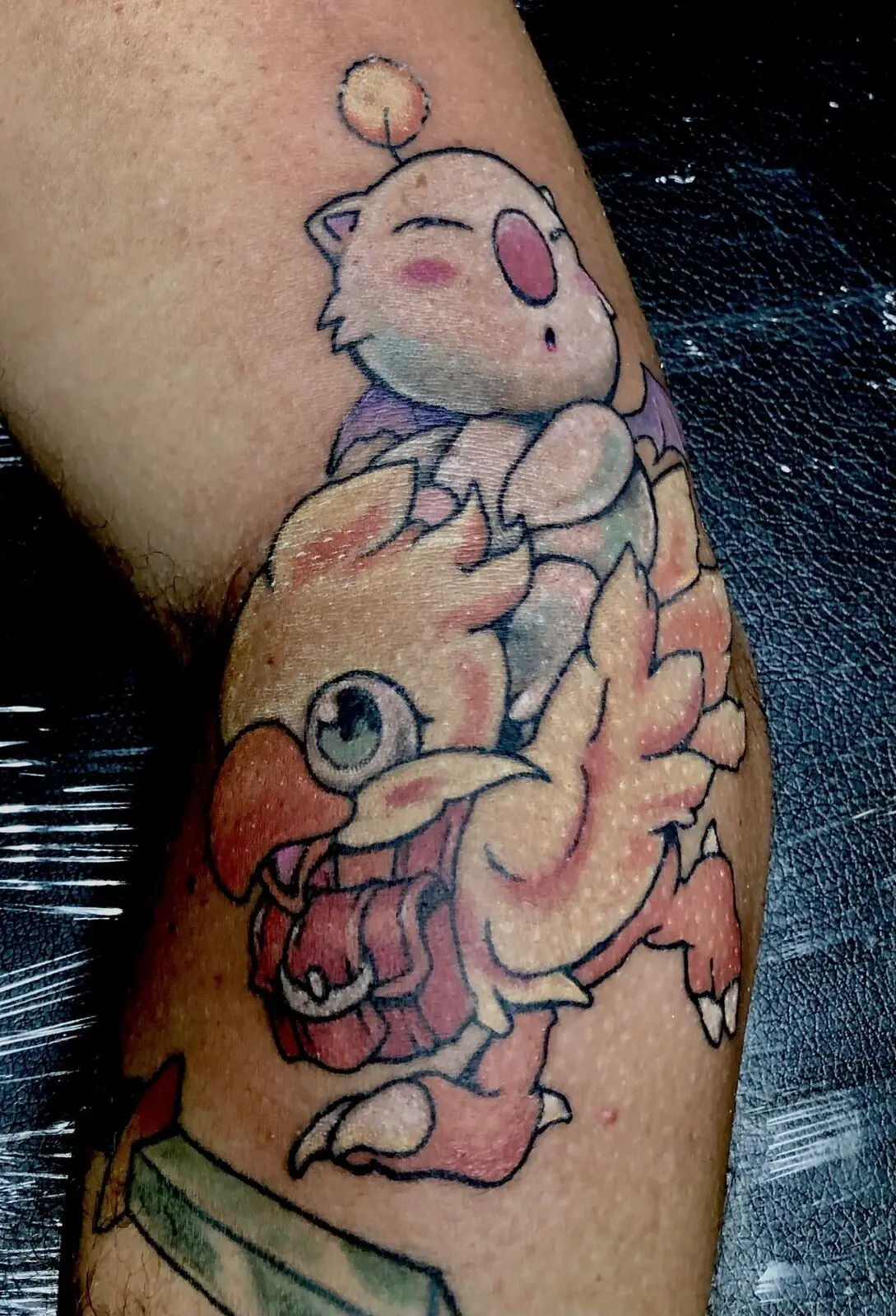 Soft pastel color tattoo of a moogle riding a chocobo inspired fantasy character piece