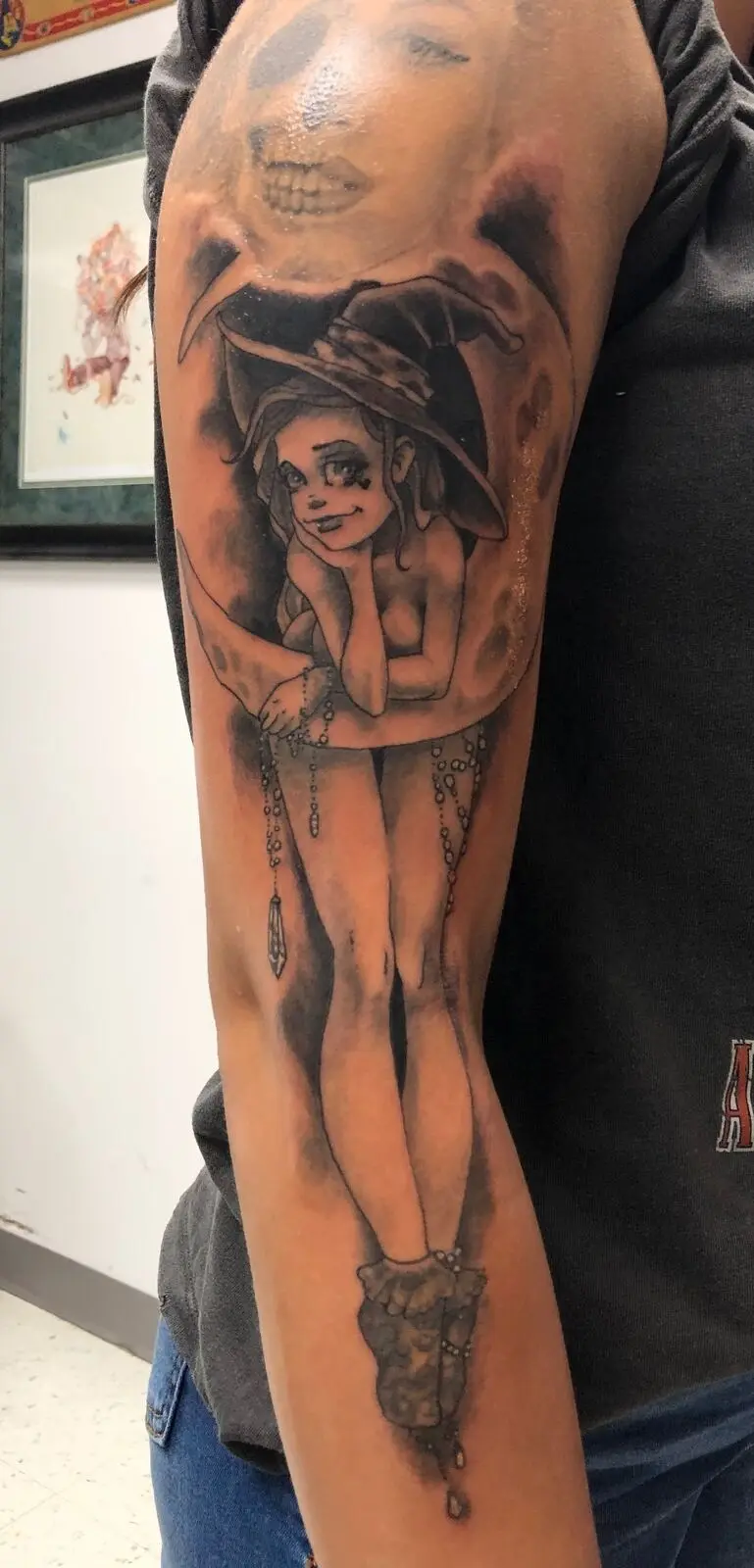 Black and grey illustrative witch pinup sleeve with skull moon and jewels
