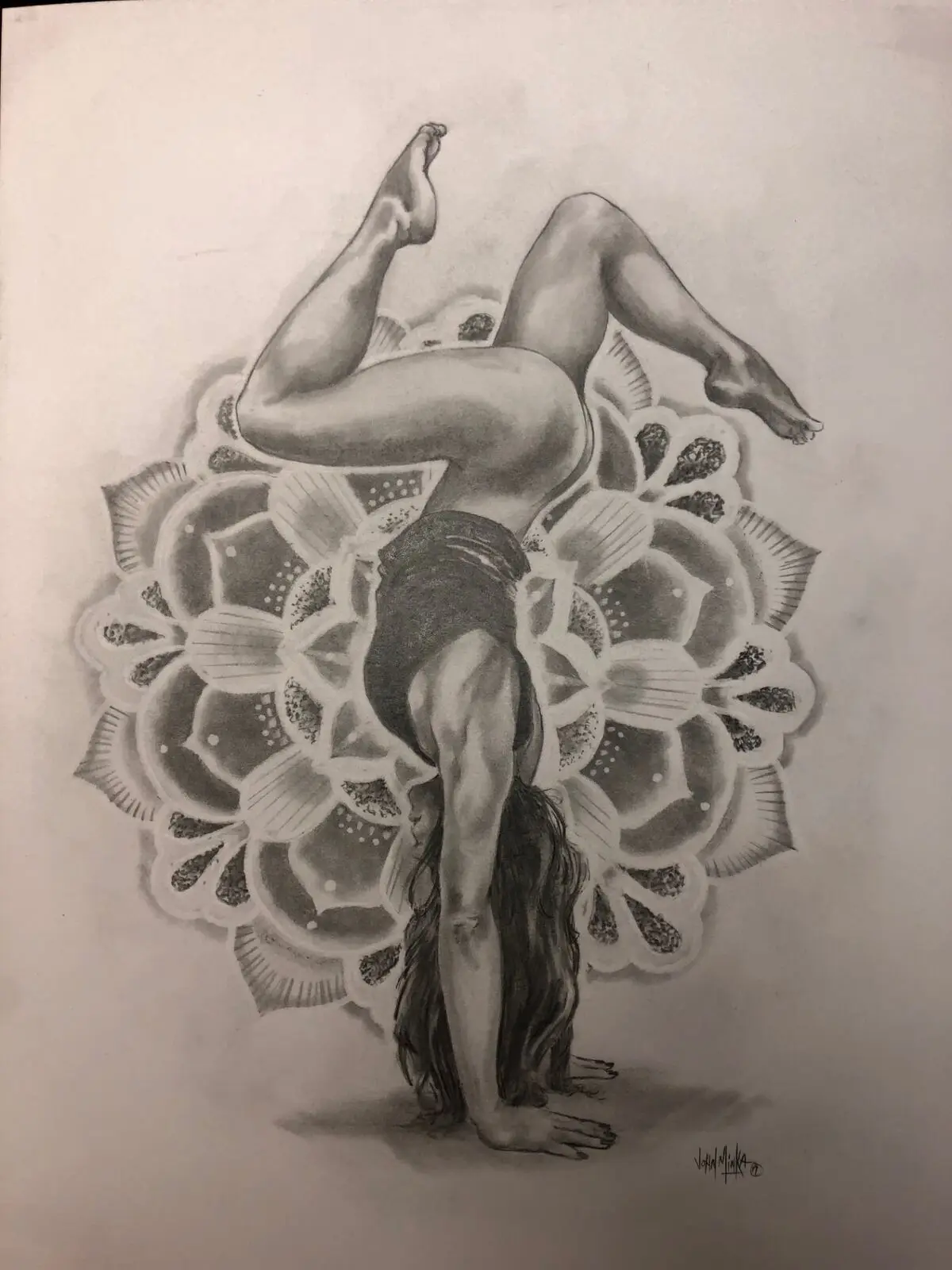 Black and grey realism drawing of a contorted yoga figure in a backbend layered over a detailed lotus mandala